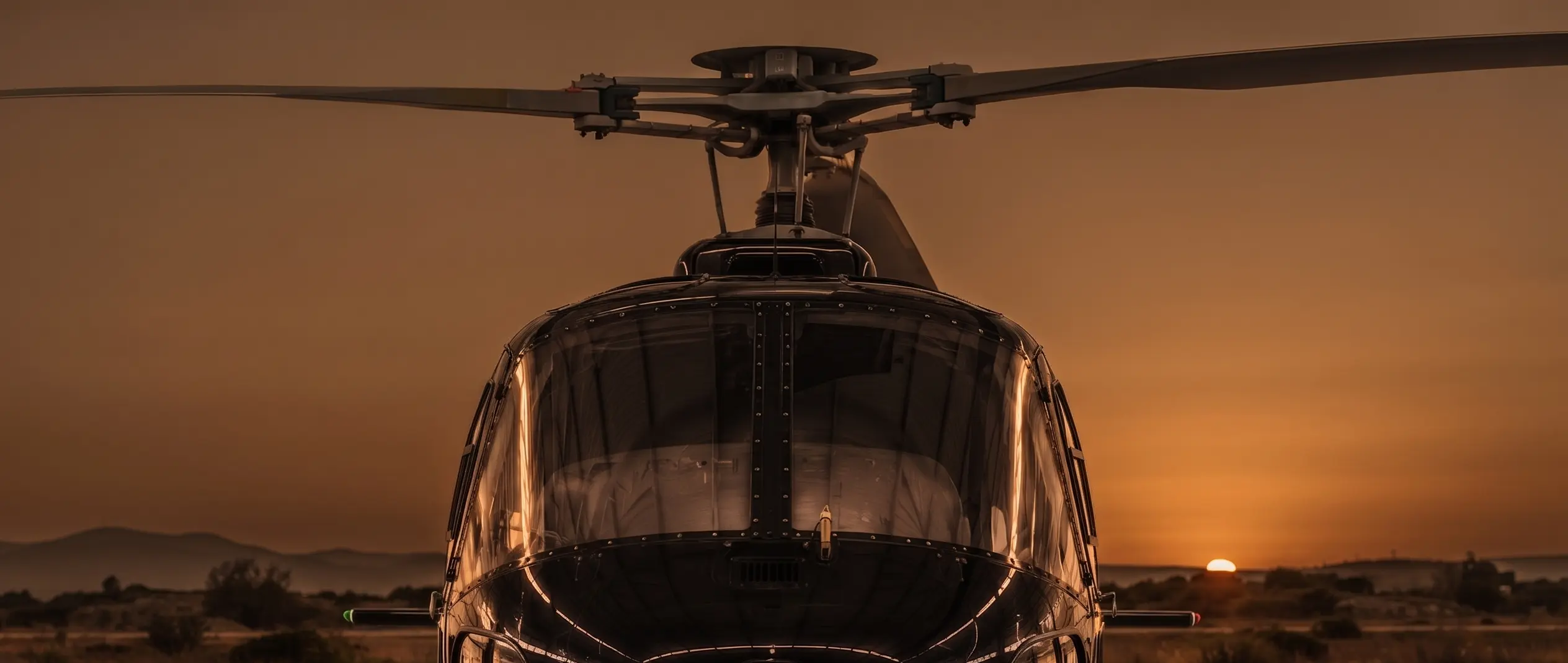 KingBirds helicopter on the ground at sunset